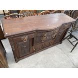 A CARVED MAHOGANY SIDEBOARD WITH FOUR DOORS AND FOUR DRAWERS