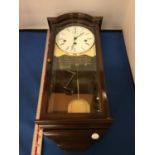 A KIENINGER WALL CLOCK WITH KEY