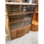 A WALNUT CHINA CABINET WITH SIX SLIDING GLASS DOORS AND LOWER DOOR