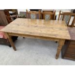 A RECTANGULAR PINE DINING TABLE