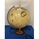 A LIGHT UP GLOBE ON A WOODEN BASE