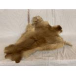 A GOAT SKIN RUG