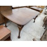 A MAHOGANY WIND OUR DINING TABLE ON CABRIOLE SUPPORTS