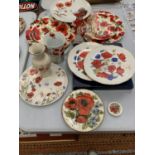 A LARGE COLLECTION OF POPPY THEMED CERAMICS TO INCLUDE PLATES, VASE, LADY FIGURINE ETC