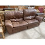 A BROWN LEATHER TWO SEATER SOFA