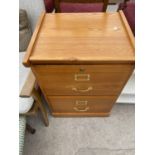 A PINE TWO DRAWER FILING CABINET