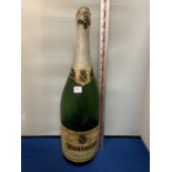 A LARGE CHAMPAGNE BOTTLE