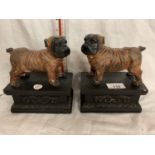 A PAIR OF BULLDOGS ON ORNATE PLINTHS