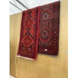 TWO RED PATTERNED PERSIAN HALL RUNNERS 145 CM X 54 CM AND 190 CM X 54 CM