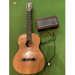 AN ACCOUSTIC GUITAR AND A ROBERTS RADIO 8900
