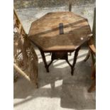 AN OCTAGONAL MAHOGANY SIDE TABLE WITH GALLERIED LOWER SHELF (REQUIRE MINOR REPAIR TO SHELF)