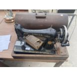 A VINTAGE SINGER SEWING MACHINE