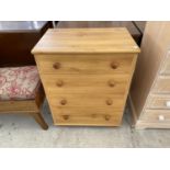 A PINE EFFECT CHEST OF FOUR DRAWERS