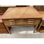 AN OAK PLAN CHEST WITH THREE DRAWERS