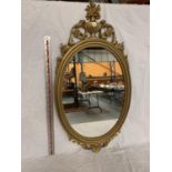 AN ORNATE GILT FRAMED MIRROR