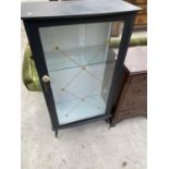 A RETRO BLACK CABINET WITH SINGLE GLAZED DOOR