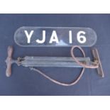 A VINTAGE W H BAILEY AIR PUMP AND A VINTAGE VEHICLE REGISTRATION PLATE