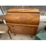 A RETRO TEAK ROLL TOP BUREAU WITH THREE DRAWERS AND FITTED INTERIOR