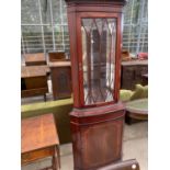 A MAHOGANY CORNER CABINET WITH LOWER DOOR AND UPPER GLAZED PANEL DOOR