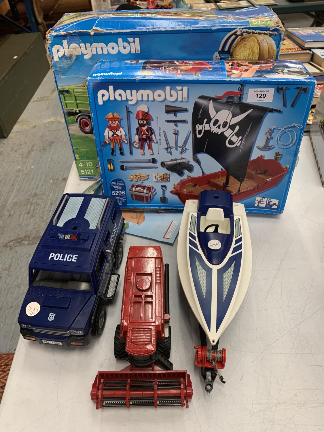 A SPEED BOAT, A COMBINE HARVESTER, A POLICE VAN AND TWO PLAYMOBIL KITS OF A PIRATE SHIP AND