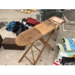 A VINTAGE WOODEN IRONING BOARD