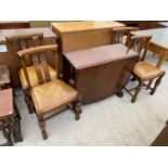 AN OAK DROP LEAF DINING TABLE AND FOUR DINING CHAIRS
