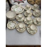 A HANDPAINTED BUTTERFLY AND LADYBIRD PATTERN SET TO INCLUDE CUPS AND SAUCERS, PLATES, BOWL ETC