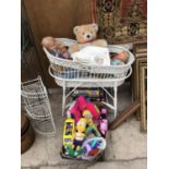 A WICKER MOSES BASKET AND TOYS