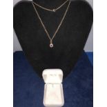 9CT GOLD GARNET AND DIAMOND SMALLL PENDANT WITH FINE CHAIN. TOTAL GROSS WEIGHT APPROX 2 GRAMS