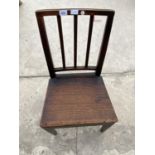 AN OAK DINING CHAIR WITH SOLID SEAT