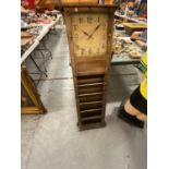 A LARGE WALL HANGING CABINET WITH CLOCK AND LETTER HOLDERS