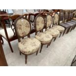 FOUR CARVED MAHOGANY DINING CHAIRS