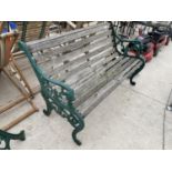 A GARDEN BENCH WITH CAST IRON ENDS