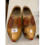 A PAIR OF DECORATIVE WOODEN CLOGS
