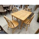 A BEECH DINING TABLE AND FOUR DINING CHAIRS