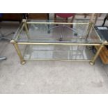 A BRASS COFFEE TABLE WITH GLASS TOP