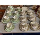 TWO SETS OF TRIOS AND CAKE PLATES