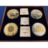 A BOXED SET OF FOUR LARGE COINS DEPICTING THE TITANIC'S 100TH ANNIVERSARY, CONCORD'S FINAL