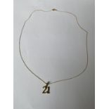 A 9 CARAT YELLOW GOLD "21" PENDANT AND NECKLACE + 1.1 GRAMS