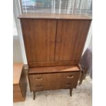 A WRIGHTON RETRO TEAK DRESSING CABINET WITH TWO DOORS AND TWO DRAWERS