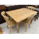 A RECTANGULAR PINE DINING TABLE AND THREE CHAIRS