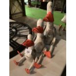 A GRADUATED SET OF THREE VINTAGE STYLE WOODEN WHITE PAINTED DUCKS SHELF PUPPETS