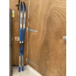 A PAIR OF ROSSIGNOL SNOW SKIS AND POLES