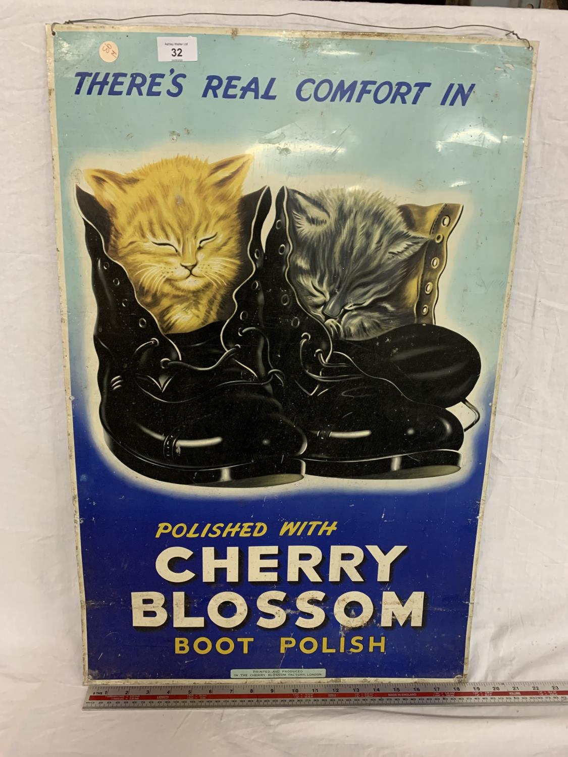 A METAL 'POLISHED WITH CHERRY BLOSSOM BOOT POLISH' SIGN