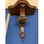 A CARVED MAHOGANY WALL SCONCE