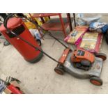 A FLYMO PETROL ROTARY MOWER WITH BRIGGS AND STRATTON ENGINE