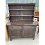 AN ERCOL ELM DRESSER WITH TWO DOORS, TWO DRAWERS AND UPPER PLATE RACK