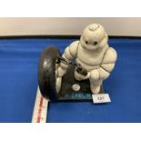 A CAST IRON MICHELIN MAN FIGURE