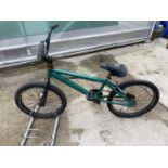 A GREEN STUNT BICYCLE