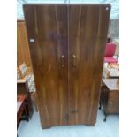 A "FITROBE" RETRO WALNUT COMPACTUM WARDROBE WITH INNER DRAWERS AND COMPARTMENTS